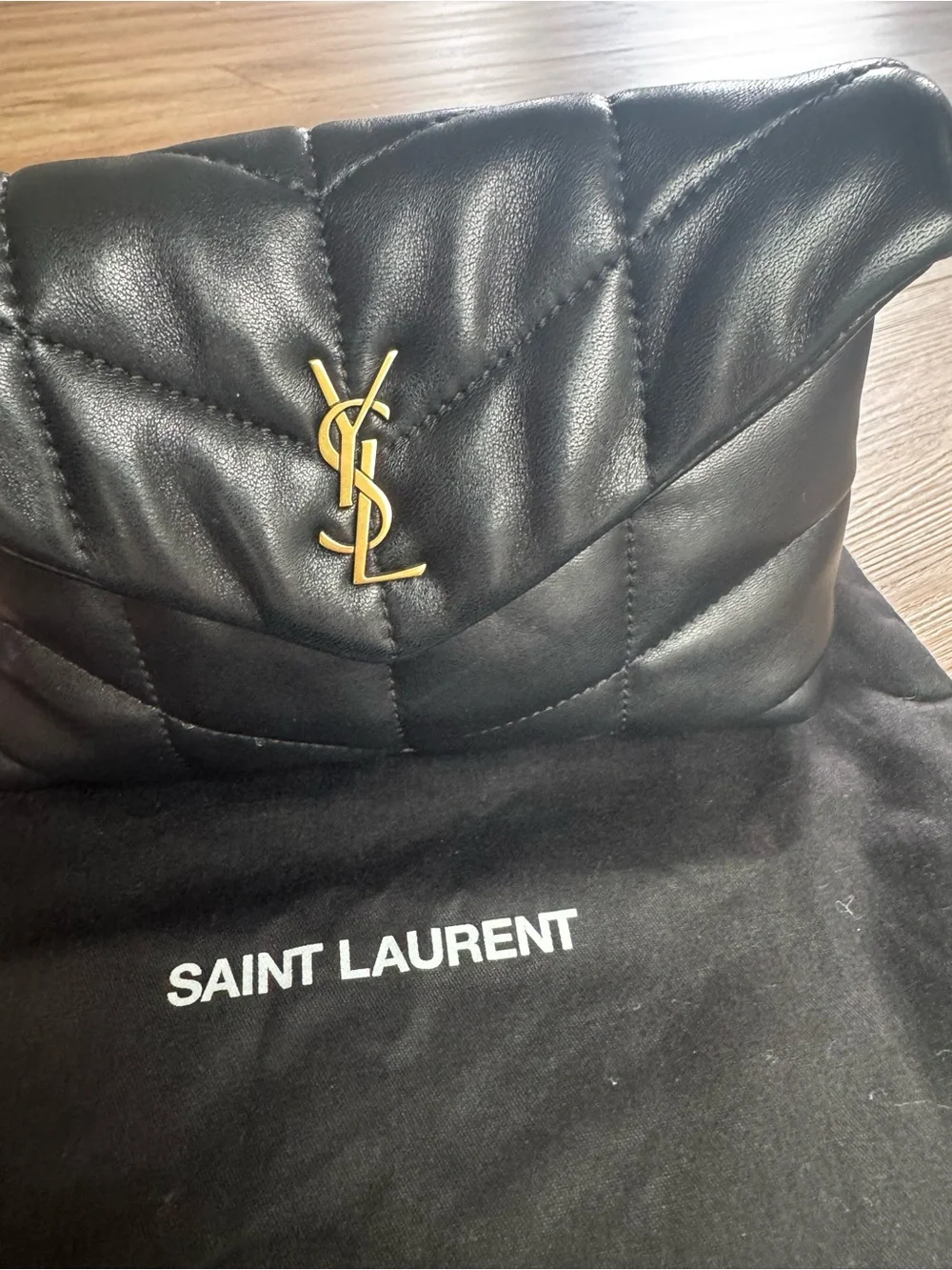 Saint Laurent Black Quilted Lambskin Clutch with Gold YSL Accent
Small 8”x 5” - Picture 4 of 6